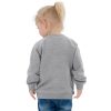 This baby organic bomber jacket is made from organic cotton and recycled polyester, making it a sustainable choice for anyone interested in environmentally friendly clothing options. With its soft fabric, ribbed cuffs, and brass poppers, it guarantees comfort and style for any kid. • 80% organic cotton, 20% recycled polyester • Heather Grey is 71% cotton, 21% recycled polyester, 8% viscose • Fabric weight: 8.3 oz/yd² (280 g/m²) • Cotton fabric type: French terry • Smooth surface • Inside back neck locker patch • Antique brass color poppers at front • Welt pockets at front • Ribbed hem and cuffs