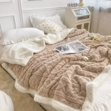 Embrace our Woven Lamb Wool Fleece Plush Throw Blanket, a must-have for anyone who craves style & coziness in their home. Experience warmth and elegance.