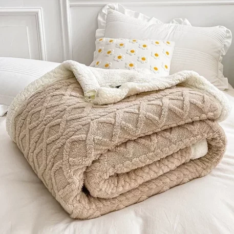 Embrace our Woven Lamb Wool Fleece Plush Throw Blanket, a must-have for anyone who craves style & coziness in their home. Experience warmth and elegance.