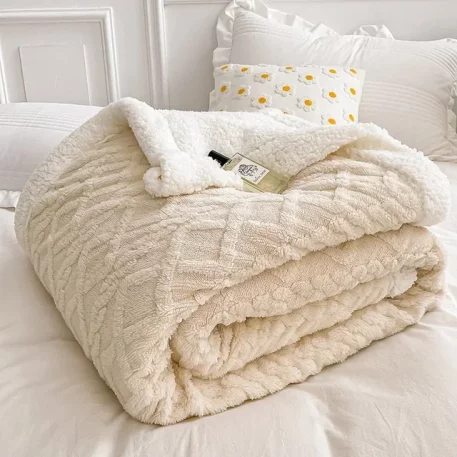 Embrace our Woven Lamb Wool Fleece Plush Throw Blanket, a must-have for anyone who craves style & coziness in their home. Experience warmth and elegance.