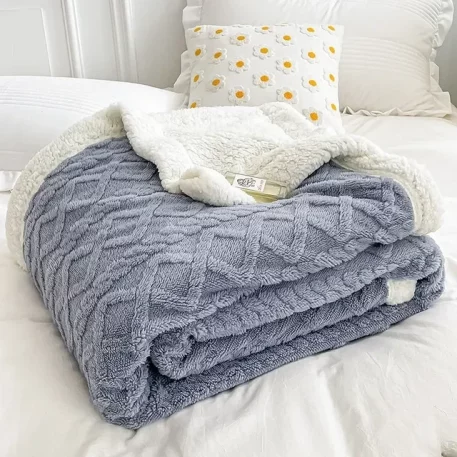 Embrace our Woven Lamb Wool Fleece Plush Throw Blanket, a must-have for anyone who craves style & coziness in their home. Experience warmth and elegance.