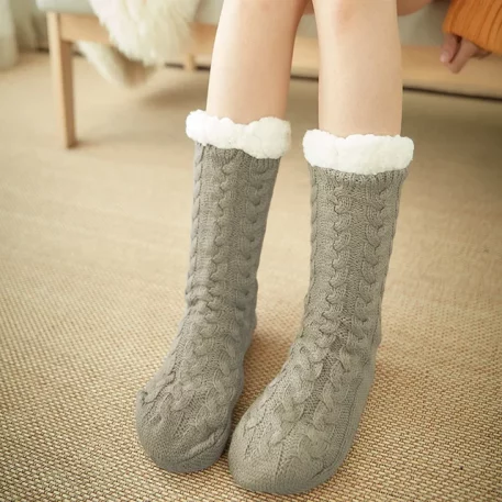 Luxurious Woven Fuzzy Thermal Non-slip Grip Plush Slipper Socks, crafted for year-round comfort and style. Made from premium cotton, acrylic, and spandex blend, offering unparalleled durability. Stay Warm with insulating plush fleece lining, keeping feet snug in any temperature. Non-slip silicone grip ensures stability on all surfaces, perfect for home relaxation or festive occasions. Available in elegant Black, chic Blue Coffee, soft Pink, and more. One-Size fits US sizes 5.5 to 11, with plush thickness for ultimate comfort. Elevate your wardrobe with these practical yet luxurious socks, ideal for unwinding or celebrating indoors. Perfect gift for warmth and style enthusiasts.
