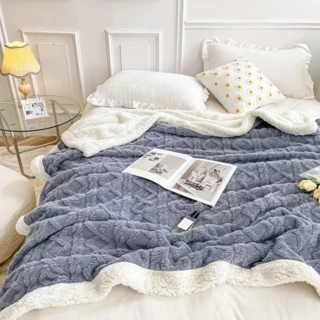 Embrace our Woven Lamb Wool Fleece Plush Throw Blanket, a must-have for anyone who craves style & coziness in their home. Experience warmth and elegance.