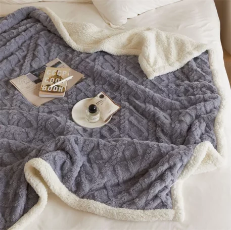 Embrace our Woven Lamb Wool Fleece Plush Throw Blanket, a must-have for anyone who craves style & coziness in their home. Experience warmth and elegance.