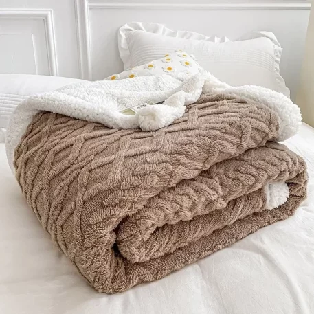 Embrace our Woven Lamb Wool Fleece Plush Throw Blanket, a must-have for anyone who craves style & coziness in their home. Experience warmth and elegance.