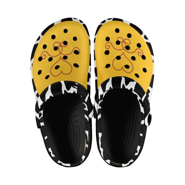 Cow print western clog with a yellow upper, black base, view 1