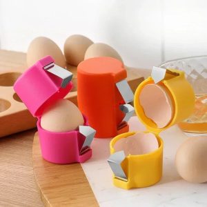 Three egg shell openers in pink, orange and yellow with metal blades