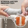 Metal mesh scrubbing cloth being rinsed under running water