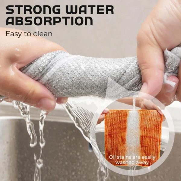 Metal mesh scrubbing cloth being rinsed under running water